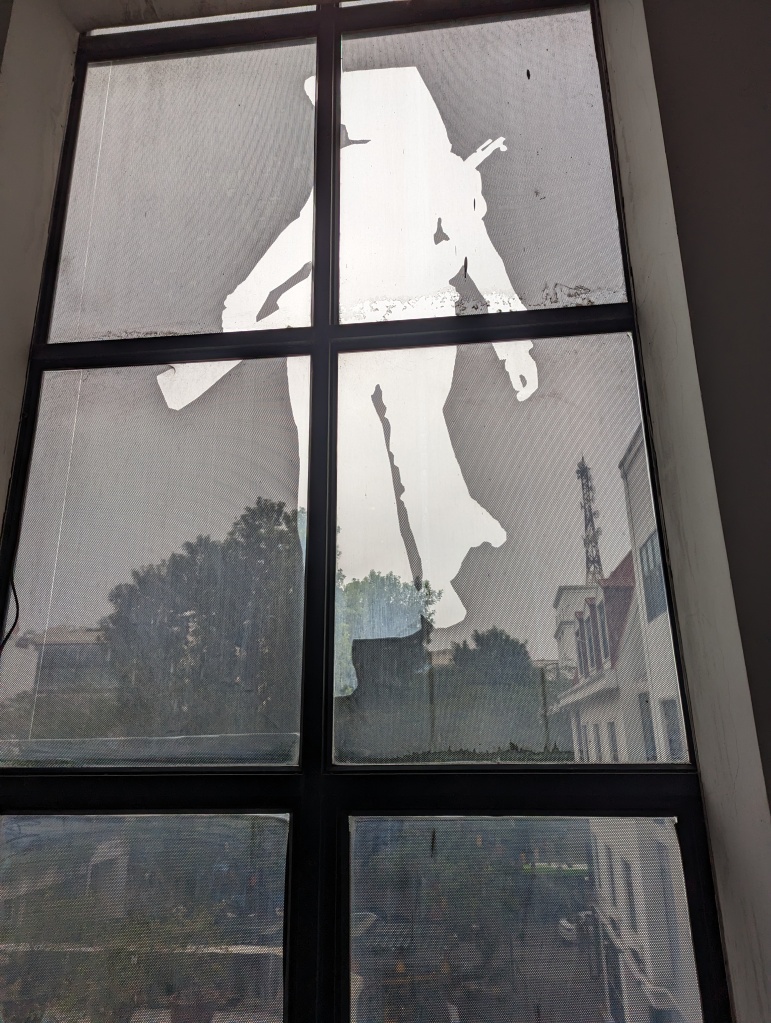 outline of a female solider on a window of the Vietnamese Women's exhibition in Hanoi.